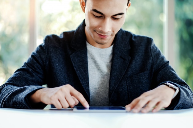 A split-screen image. On one side, a person is filling out an official form with a pen. On the other side, the same person is smiling and holding a check, implying successful recovery of unclaimed funds.